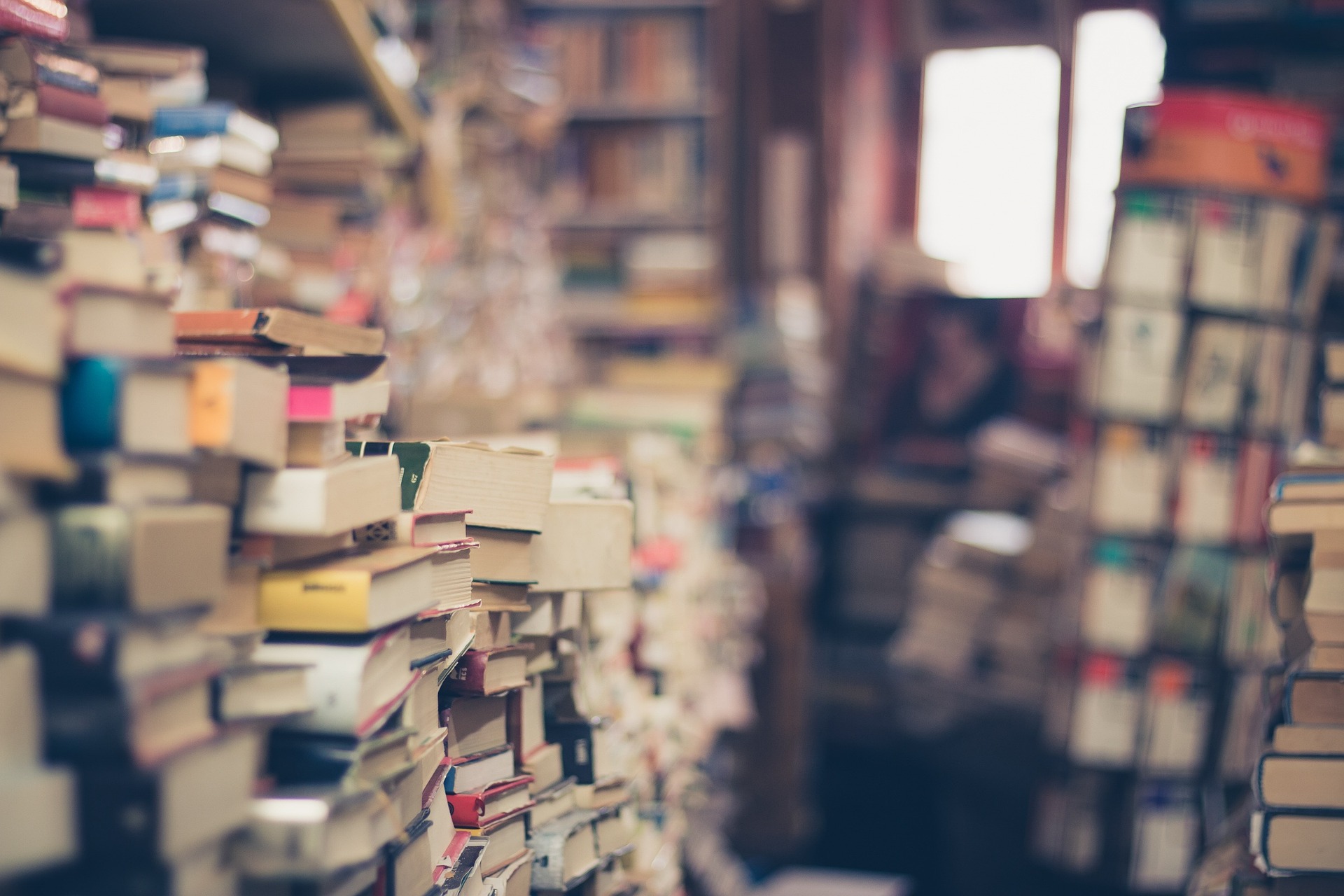 A store full of books stacked ceiling high full of great stories