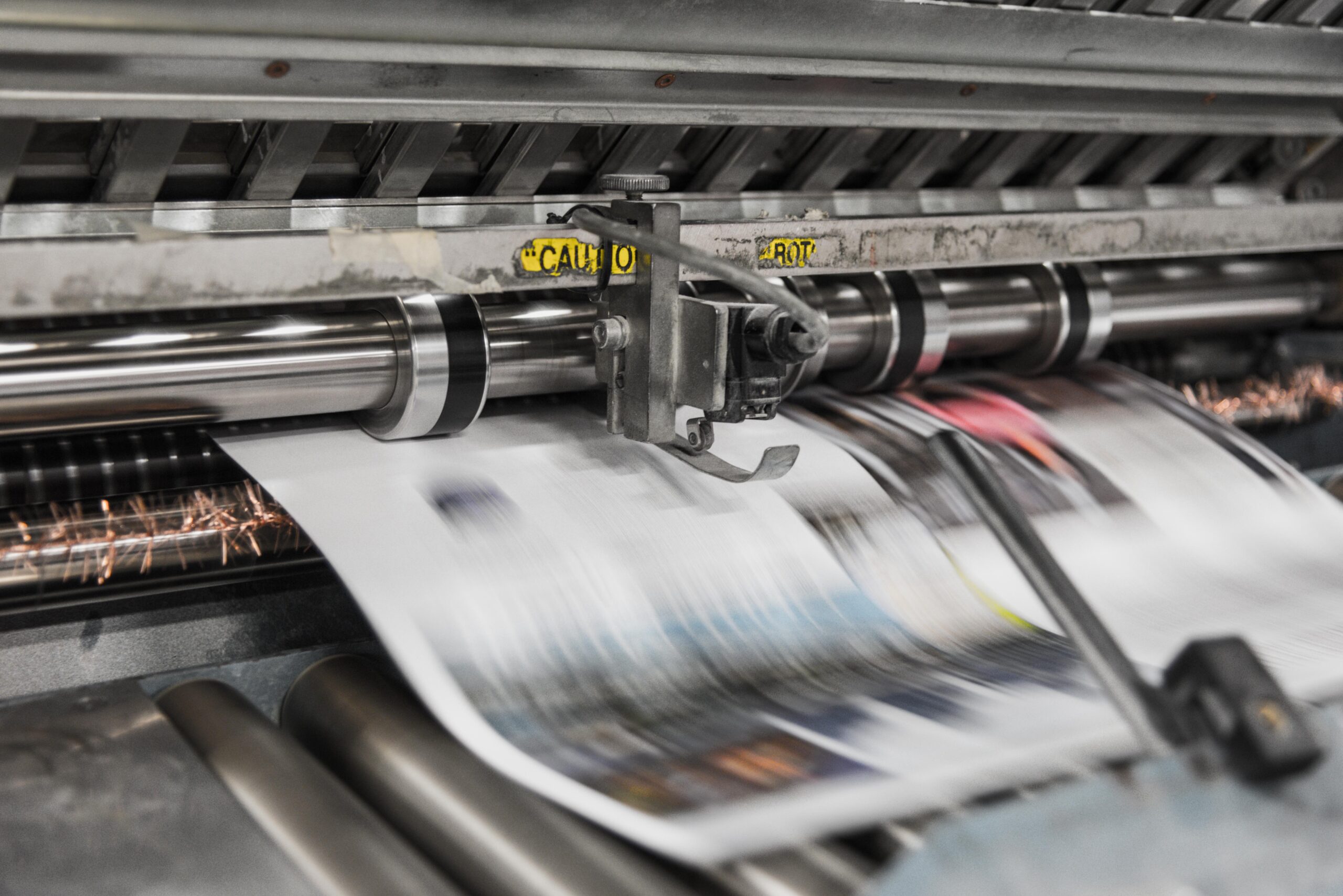 A printing machine printing the newspaper of the day.